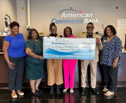American Commerce Bank with DRMI in a partner support photo.
